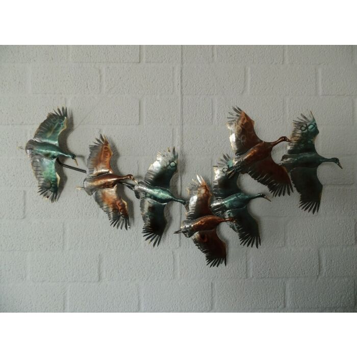 Gekleurde wanddecoratie met vliegende eenden