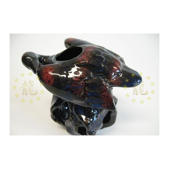 Zwaan vliegend oliebrander zwart